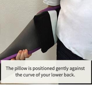 The pillow is positioned gently againts the curve of your back.